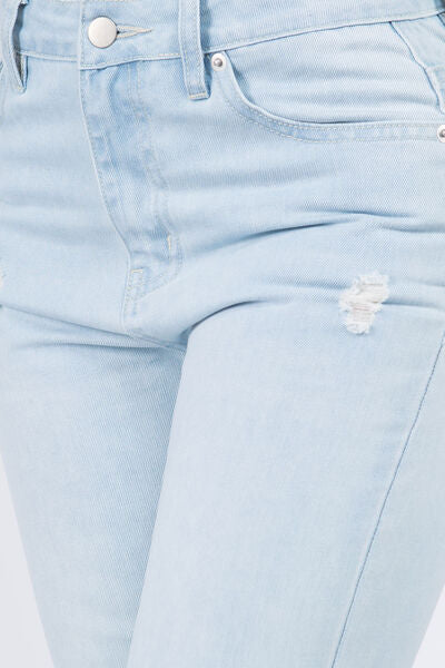 Trendy High Waist Distressed Jeans with Raw Hem Finish